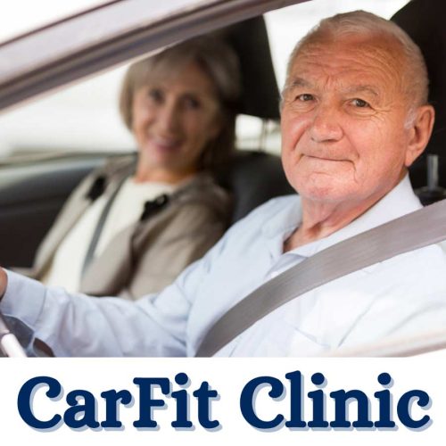 An older man and a woman sitting in a car